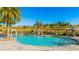 Resort-style pool area with cabanas and lush landscaping at 6250 Grandview Hill Ct, Bradenton, FL 34203