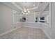 The dining room features elegant lighting, recessed ceiling, and mirrored walls for added spaciousness at 6250 Grandview Hill Ct, Bradenton, FL 34203