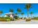 Inviting gatehouse entrance with palm trees and well-maintained landscaping at 6250 Grandview Hill Ct, Bradenton, FL 34203