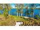 Picturesque lakefront area with seating to enjoy beautiful water views at 6250 Grandview Hill Ct, Bradenton, FL 34203