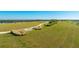 Beautiful community park with walking trails, grassy areas and a bench for relaxing and enjoying the scenery at 6250 Grandview Hill Ct, Bradenton, FL 34203