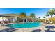 Beautiful pool area with palm trees and ample seating at 6250 Grandview Hill Ct, Bradenton, FL 34203