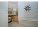Bright bathroom with a large soaking tub and starburst mirror on the wall at 6307 Laurel Creek Trl, Ellenton, FL 34222