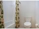 Bathroom featuring toilet, bathtub with shower and patterned shower curtain at 6307 Laurel Creek Trl, Ellenton, FL 34222