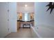 Bathroom with soaking tub, vanity with mirrors and wooden stool seating at 6307 Laurel Creek Trl, Ellenton, FL 34222