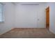 Bedroom featuring neutral walls, carpet flooring and doorway with door to the adjacent room at 6307 Laurel Creek Trl, Ellenton, FL 34222