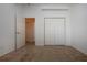 Neutral bedroom with wall closet and open door to an adjacent room at 6307 Laurel Creek Trl, Ellenton, FL 34222