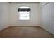 A bright bedroom with a floral cornice and window shutters for sun control at 6307 Laurel Creek Trl, Ellenton, FL 34222
