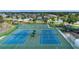 Aerial view of tennis courts, basketball court and playground in a well-maintained community at 6307 Laurel Creek Trl, Ellenton, FL 34222