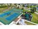 Aerial view of community amenities with tennis courts, basketball court, and playground at 6307 Laurel Creek Trl, Ellenton, FL 34222