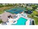 Aerial view of community amenities including a pool, tennis courts, basketball court, and playground at 6307 Laurel Creek Trl, Ellenton, FL 34222