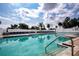 Beautiful swimming pool with lounge chairs and clear, inviting water, perfect for a refreshing dip at 6307 Laurel Creek Trl, Ellenton, FL 34222