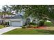 This charming home features a meticulously landscaped yard and an attached two-car garage at 6307 Laurel Creek Trl, Ellenton, FL 34222