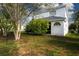 Exterior elevation of the house back with surrounding landscaping at 6307 Laurel Creek Trl, Ellenton, FL 34222