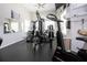 A well-equipped gym features various exercise machines, weights, and a large mirror for workout convenience at 6307 Laurel Creek Trl, Ellenton, FL 34222