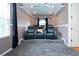 Comfortable home theater features plush seating, a large screen, and atmospheric lighting at 6307 Laurel Creek Trl, Ellenton, FL 34222