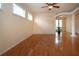 Bright living room features hardwood floors, large windows, and views of the outdoors at 6307 Laurel Creek Trl, Ellenton, FL 34222