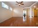 Spacious living room with hardwood floors, ceiling fan and natural light at 6307 Laurel Creek Trl, Ellenton, FL 34222