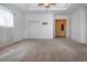 Main bedroom with a ceiling fan, carpeted floors, and ample space, featuring access to the hallway at 6307 Laurel Creek Trl, Ellenton, FL 34222