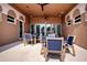 Outdoor patio with tables and chairs, offering a comfortable space for relaxation and socializing at 6307 Laurel Creek Trl, Ellenton, FL 34222