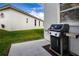Outdoor patio area with a grill and view of the house at 6307 Laurel Creek Trl, Ellenton, FL 34222