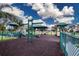 Outdoor playground with slides, swings, and climbing structures, providing a fun and safe play area at 6307 Laurel Creek Trl, Ellenton, FL 34222