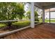 A relaxing screened in covered porch with wood flooring at 6307 Laurel Creek Trl, Ellenton, FL 34222