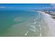 Beautiful beach aerial showcasing pristine white sand and clear turquoise water at 6480 Midnight Pass Rd # 311, Sarasota, FL 34242