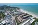 An aerial view shows the beach front property and ocean views at 6480 Midnight Pass Rd # 311, Sarasota, FL 34242