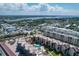 Scenic aerial view of the complex with multiple pools and lush landscaping at 6480 Midnight Pass Rd # 311, Sarasota, FL 34242