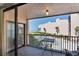 Relaxing balcony with a view of the ocean, pool, and well-maintained landscaping at 6480 Midnight Pass Rd # 311, Sarasota, FL 34242