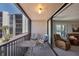 Relaxing balcony with seating area that features views of the city at 6480 Midnight Pass Rd # 311, Sarasota, FL 34242
