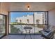 Balcony with seating overlooking a community pool and beachfront at 6480 Midnight Pass Rd # 311, Sarasota, FL 34242