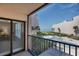 Relaxing balcony view overlooking the community pool and beach at 6480 Midnight Pass Rd # 311, Sarasota, FL 34242