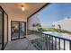 Balcony with seating overlooking a community pool and beachfront at 6480 Midnight Pass Rd # 311, Sarasota, FL 34242
