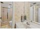 Well-lit bathroom featuring a glass-enclosed shower and a pristine white vanity at 6480 Midnight Pass Rd # 311, Sarasota, FL 34242
