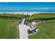 Convenient beach access path with benches offers a tranquil retreat near the beautiful ocean at 6480 Midnight Pass Rd # 311, Sarasota, FL 34242