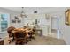Cozy dining area with a wooden table and brown leather chairs adjacent to the kitchen, offering a comfortable seating arrangement at 6480 Midnight Pass Rd # 311, Sarasota, FL 34242