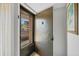Entryway featuring a secured front door, exterior views and an interior art piece at 6480 Midnight Pass Rd # 311, Sarasota, FL 34242