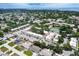 A vibrant neighborhood with low-rise apartment buildings, tennis courts, and mature trees at 6760 14Th S St, St Petersburg, FL 33705