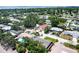This aerial view features a charming neighborhood with tree-lined streets and manicured lawns at 6760 14Th S St, St Petersburg, FL 33705