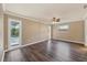 Bedroom featuring wood-look floors, recessed lights, neutral walls, and bright windows at 6760 14Th S St, St Petersburg, FL 33705