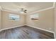 This bedroom features updated flooring, natural light, and a ceiling fan at 6760 14Th S St, St Petersburg, FL 33705