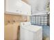 Laundry Room includes a washing machine and storage at 6760 14Th S St, St Petersburg, FL 33705