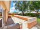 Back patio includes a block seating area for entertaining at 6760 14Th S St, St Petersburg, FL 33705