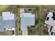 Aerial view showcases the property's layout, fully fenced yard, and proximity to surrounding neighborhood at 6841 Roxbury Dr, Sarasota, FL 34231