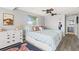 Cozy bedroom with a dresser and a view to the bathroom at 6841 Roxbury Dr, Sarasota, FL 34231