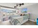Bright bedroom with large windows, light walls, and modern ceiling fan at 6841 Roxbury Dr, Sarasota, FL 34231