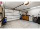 Spacious garage featuring epoxy floors, ample storage, and a work area, perfect for projects at 6841 Roxbury Dr, Sarasota, FL 34231