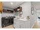 Convenient laundry area with washer, dryer, utility sink, and storage at 6841 Roxbury Dr, Sarasota, FL 34231